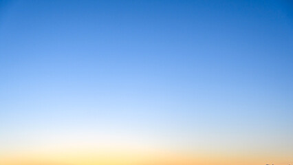 Soft yellow and blue colors in a dawn sky