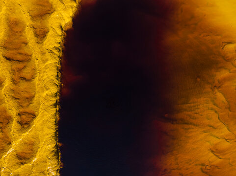 Aerial view of the surreal and vibrant Rio Tinto river with colorful and unique formations, Minas de Riotinto, Huelva, Spain.