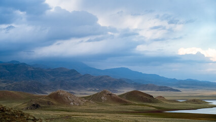 Obraz premium rocky mountain peaks in the clouds. cloud cover in the mountains