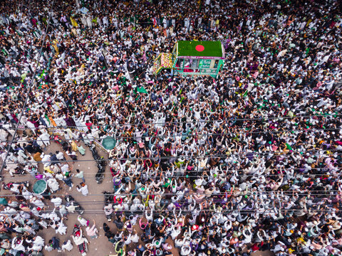Chittagong, Bangladesh - 15 September 2024: Aerial view of a vibrant procession celebrating Milad un Nabi with a joyous crowd and colorful flags, Chittagong, Chittagong, Bangladesh.