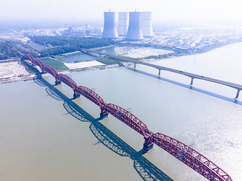 Aerial view of hardinge bridge over padma river with cooling towers in the background, Ishwardi, Pabna, Bangladesh.
