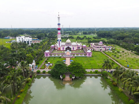 Aerial view of baitul aman jame mosque surrounded by tranquil gardens and a serene pond, Barishal, Barishal, Bangladesh.