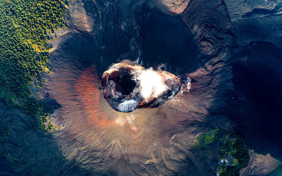 Aerial drone view of active Rinjani volcano during sunrise on the island of Lombok, Indonesia