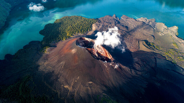Aerial drone view of active Rinjani volcano during sunrise on the island of Lombok, Indonesia