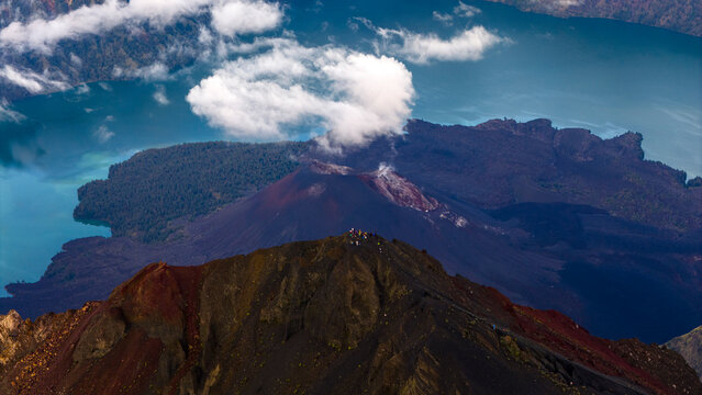 Aerial drone view of the top of active Rinjani volcano during sunrise on the island of Lombok, Indonesia