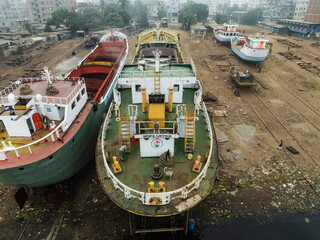 Keraniganj, Bangladesh - 02 February 2025: Aerial view of bustling shipyard with ships and boats under construction, Subhadya, Keraniganj, Dhaka, Bangladesh.