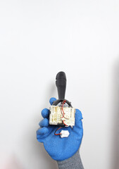 car switching handle in a hand in a blue glove
