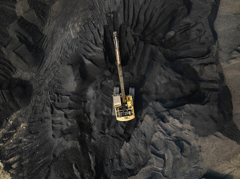 Aerial view of an industrial coal factory with cranes and heavy machinery, Amin Bazar, Savar, Dhaka, Bangladesh.
