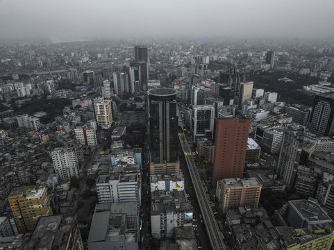 Aerial view of bustling cityscape with high-rise buildings and dense urban landscape, Motijheel Thana, Dhaka, Bangladesh.