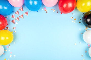colorful balloons and confetti on a blue background