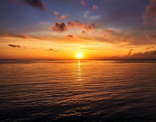 tranquil sunset over the ocean, with the sky painted in warm 