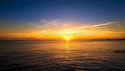 Obraz premium tranquil sunset over the ocean, with the sky painted in warm 