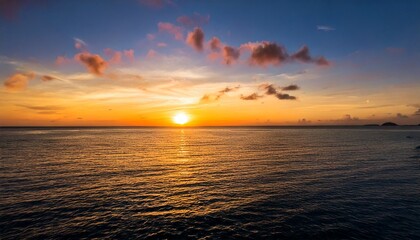 Obraz premium tranquil sunset over the ocean, with the sky painted in warm 