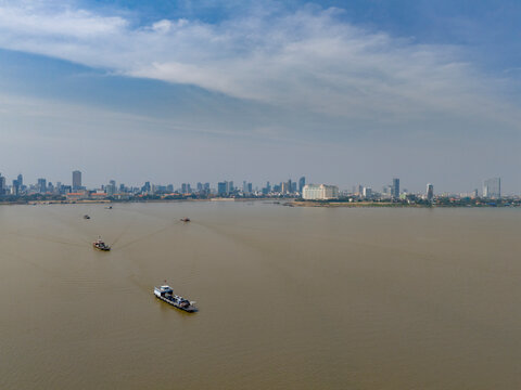 Aerial view of Mekong and Tonle Sap river with urban skyline and boats, Akreiy Ksatr, Lvea Aem District, Kandal, Cambodia.