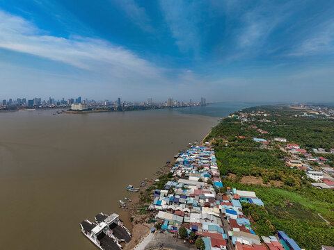Aerial view of the scenic skyline and residential buildings along the Mekong and Tonle Sap rivers, Akreiy Ksatr, Lvea Aem District, Kandal, Cambodia.