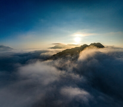 Aerial view of Nong Khiaw above the fog at sunrise with majestic mountains, Ngoy District, Luang Prabang, Laos.