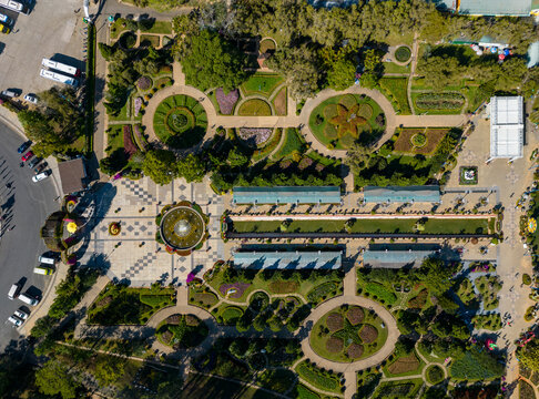 Aerial view of a vibrant structured garden with floral patterns and pathways, Ward 8, Da Lat, Lam Dong, Vietnam.