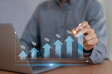 Interest rates and dividends, business development with percentage symbol and upward arrow for...