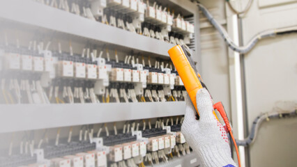 Electrical engineer checks the operation of the electrical control unit.