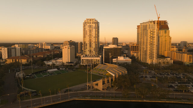 Aerial view of downtown St. Petersburg with al Lang Stadium and modern skyscrapers at sunset, Florida, United States.
