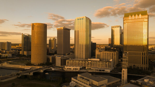 Aerial view of the modern skyline featuring the Bank of America and tall skyscrapers during sunset, Downtown Tampa, Florida, United States.