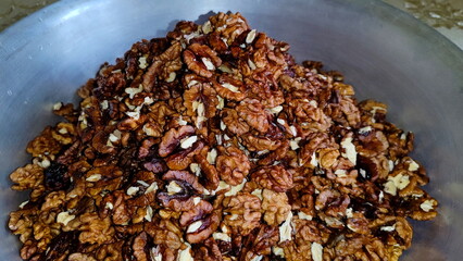 The photos show a lot of walnuts. A lot of walnuts piled up