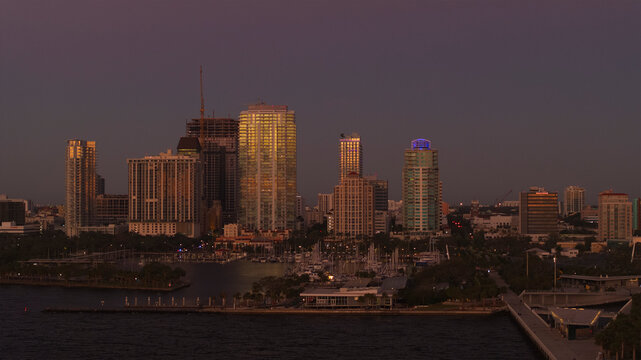 Aerial view of downtown St. Petersburg with St. Pete Pier at sunrise reflecting on the water, Florida, United States.