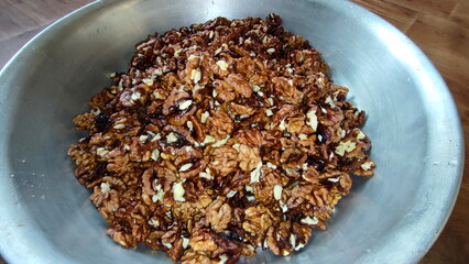 The photos show a lot of walnuts. A lot of walnuts piled up