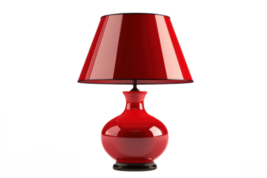A glossy red table lamp with a conical lampshade sitting on a white surface casting a soft glow around it