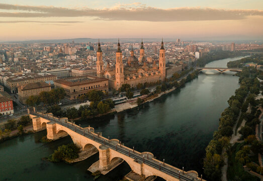 Aerial view of the beautiful Cathedral El Pilar and scenic river with historic architecture in the cityscape, Zaragoza, Aragon, Spain.