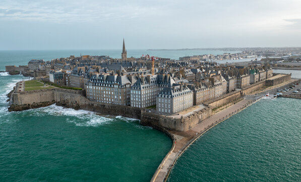 Aerial view of historic fortress and stone buildings in the picturesque old town by the sea, Saint Malo, Ille-et-Vilaine, France.
