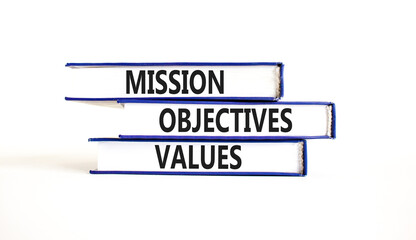 Mission objectives values symbol. Concept words Mission Objectives Values on beautiful blue white books. Beautiful white background. Business mission objectives values concept. Copy space.