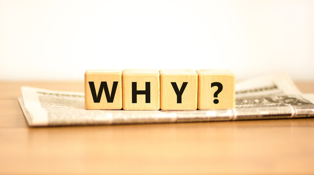 Why question symbol. Concept word Why question on beautiful wooden blocks on newspaper. Beautiful wooden table white background. Business, lifestyle, support and why question concept. Copy space.