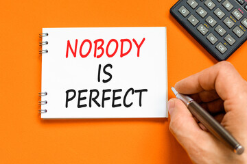Nobody is perfect symbol. Concept words Nobody is perfect on beautiful white note. Beautiful orange...