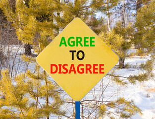 Agree to disagree symbol. Concept words Agree to disagree on beautiful yellow road sign. Beautiful...