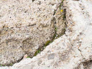 Weathered stone wall texture with cracked cement details