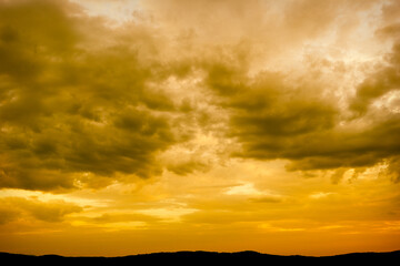 Golden Sunset Sky over Mountains