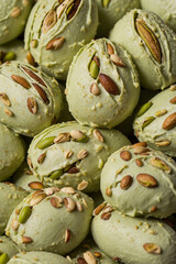 Fototapeta premium A smooth and creamy pistachio dessert served in a transparent glass. Rich green color, delicate texture, and nutty aroma make it a delicious treat