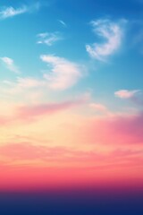 Fototapeta premium Colorful pastel sunset sky with fluffy clouds creating a stunning gradient effect