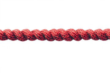A close up view of a textured red rope with a spiral pattern against a plain white background studio shot