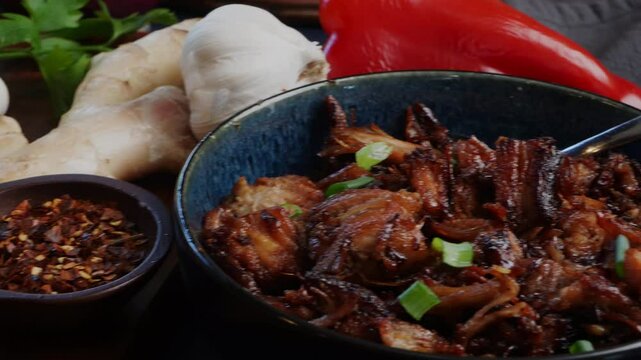 Cooking Chinese Sticky Pork for dinner.  Using a pork belly cut into pieces and adding a spicy marinade to make a delicious Asian meal.  