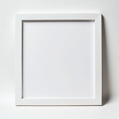 Fototapeta premium Minimalist Square White Frame on White Wall: Mockup for Artwork and Photography Display