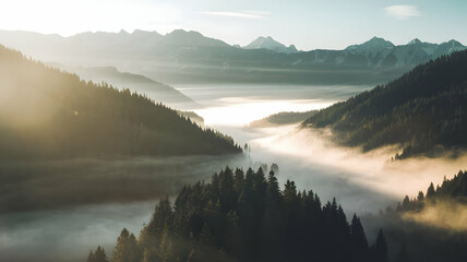 Calm misty morning over the river with fog, reflecting mountains and trees