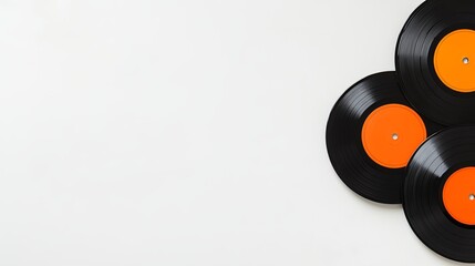 A flat lay of vintage vinyl records on a white surface, leaving space for text. picture