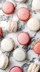 An elegant marble table displaying an artistic composition of colorful macarons perfect for a sweet treat experience