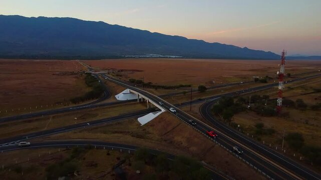Drone view of bridged crossroads of the Colima Guadalajara highway across the dry Sayula Lagoon