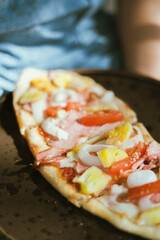 Sliced and served hawaiian mini pizza