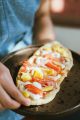 Sliced and served hawaiian mini pizza