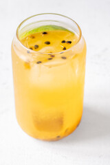 Waltzing Matilda cocktail with passion fruit, gin, and ginger ale in jar glass