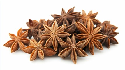 Close-up view of star anise spice piled on a white background perfect for cooking